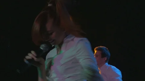 Exciting young actors dance and sing on stage in night club Stock Footage 80259785