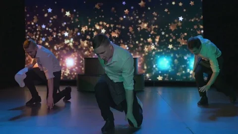 Exciting young actors dance and sing on stage in night club Stock Footage 80260307