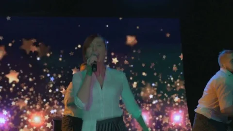 Exciting young actors dance and sing on stage in night club Stock Footage 80261463