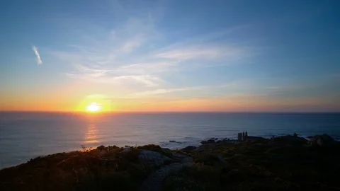 Exciting zoom in view of burning sunset over rocky ocean sea horizon timelapse Stock Footage 111318549