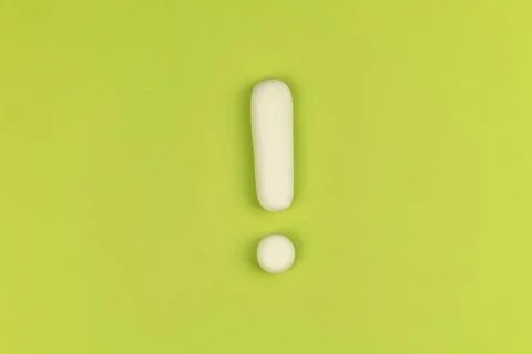 Exclamation mark on a green background. Warning sign, keep attention concept. Foto stock