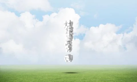 Exclamation mark on green meadow Stock Photos