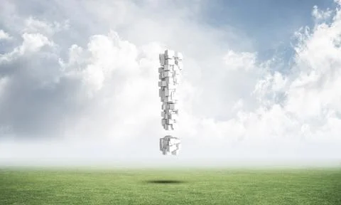 Exclamation mark on green meadow Stock Photos
