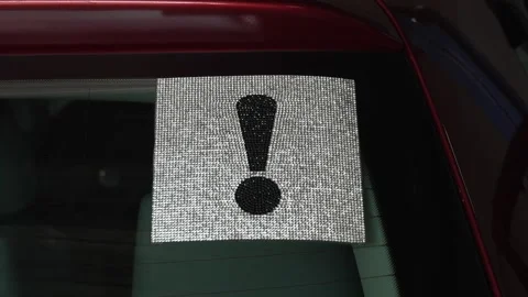 Exclamation mark warning sign made of rhinestones on car window. Stock Footage 341484750