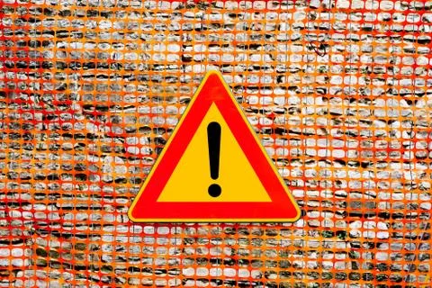 An exclamation point on a yellow background, in a red triangular sign. The Stock Photos