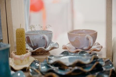 Exclusive clay tableware. Ceramic plates, dishes, and cups. Stock Photos