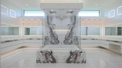 Exclusive extravagant bathroom with square bath tub decorated with grey and Stock Footage 249685375
