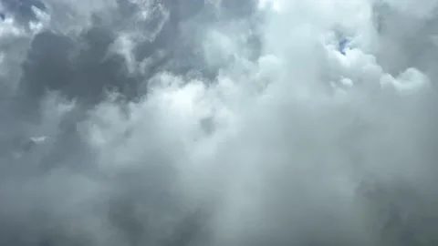 Exclusive shoot from a jet cockpit flying through stormy clouds. 4K 60 Stock Footage 211365729