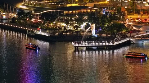 Excursion boats cruising at night, panoramic view of Marina Bay Sands, Singapore Stock Footage 112028353