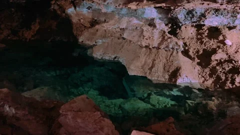 Excursion to the dark ice cave in winter. Underground large stone cave with lake Vídeos de archivo 243293516