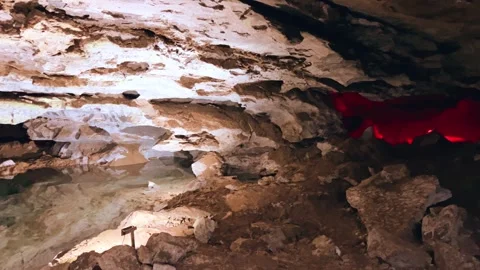 Excursion to the dark ice cave in winter. Underground large stone cave.  Vídeos de archivo 250818274