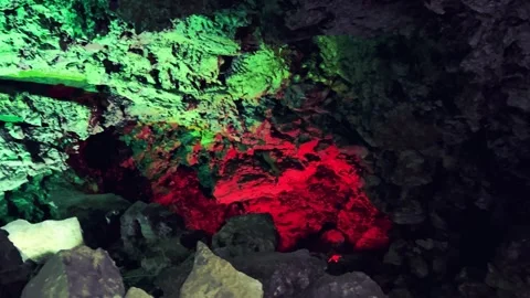 Excursion to the dark ice cave in winter. Underground large stone cave.  Vídeos de archivo 251180216