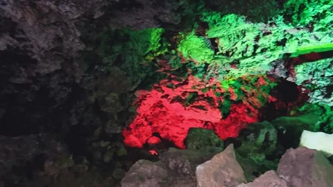 Excursion to the dark ice cave in winter. Underground large stone cave.  Vídeos de archivo 251184462