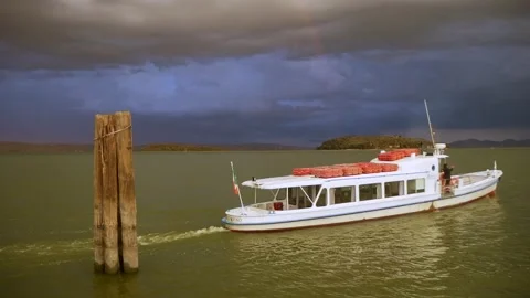 Excursion Motor Boat Departs from the Pier on the Lake Stock Footage 244815667