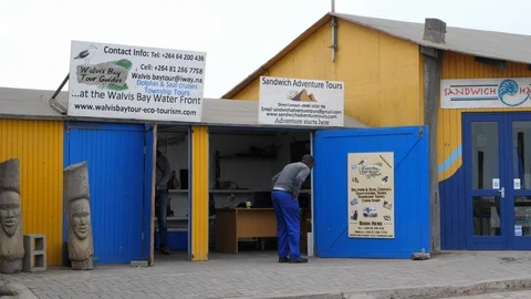 Excursion office and its owner in Swakopmund, namibia, Africa in 4K Stock Footage 91093928