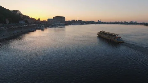 Excursion passenger ship sails to the port of the old European city at sunset Stock Footage 90362733