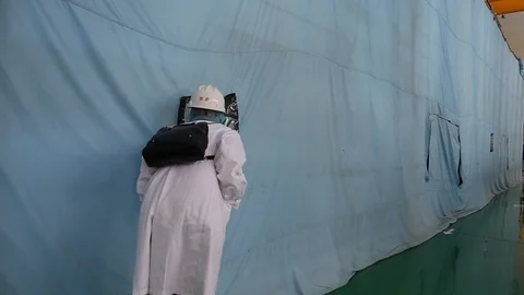 An excursion, people go through the factory workshop, where make transformers Stock Footage 89297101