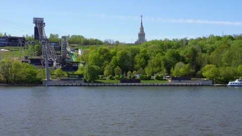 The excursion ship approaches the Vorobyovy Gory pier on the Moskva River. .. Stock Footage 274333327