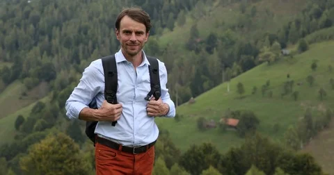 Excursionist Handsome Man Posing Smiling Looking Camera in a Beautiful Mountains Stock Footage 75822938