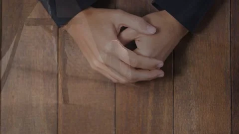 Exec hands shifting on wood table awaiting business meeting as animated overlay Stock Footage 332280571