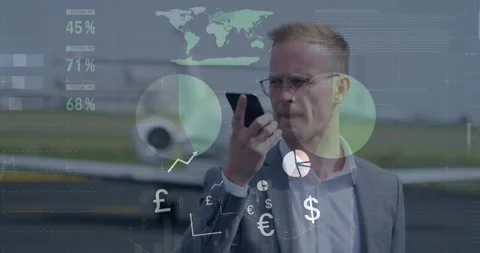 Exec holding phone on jet ramp studying data and talking while finance charts Video stock 326974444