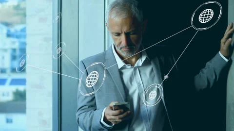 Exec leaning by window, tapping phone and starting holo nodes linking across Stock Footage 335465740