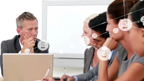 Exec starting business pitch, gesturing at laptop, team taking notes, icons Stock Footage 332504793