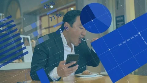 Exec tapping phone, eating in cafe, checking business data as blue charts Stock Footage 333965187