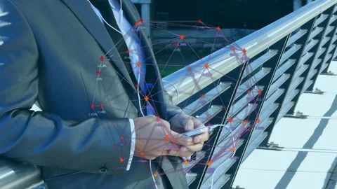 Exec tapping phone while leaning on rail, reviewing business data as overlay Stock Footage 335465709