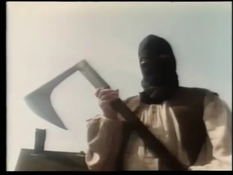 Executioner brandishing axe Stock Footage 260240487