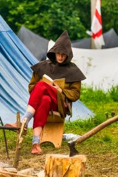 Executioner reading a book before execution Stock Photos