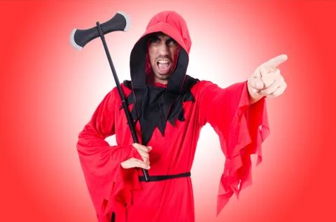 Executioner in red costume with axe on red Stock Photos