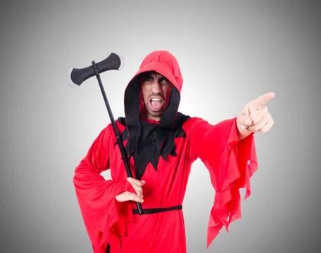 Executioner in red costume with axe on white Stock Photos
