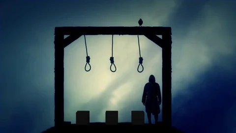 Executioner Standing in the Gallows in a Dark Cloudy Day Stock Footage