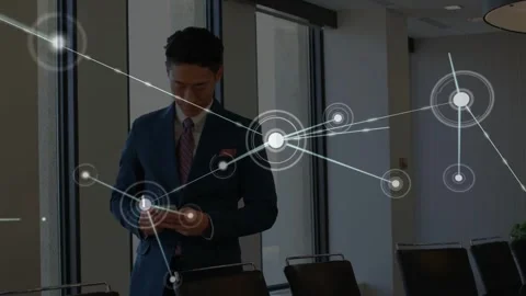 Executive adjusting tie then tapping phone, causing node overlay to grow and Stock Footage 333903309