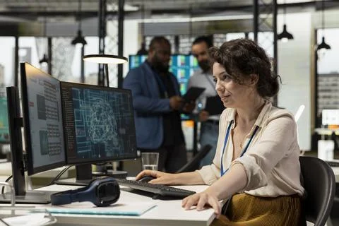Executive assistant works with AI deep learning predictive analytics on pc Stock Photos