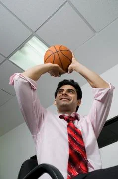 Executive with a basketball Stock Photos