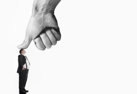 Executive Being Pushed By Large Thumb Stock Photos
