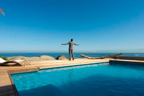 Executive breathing by the pool Stock Photos