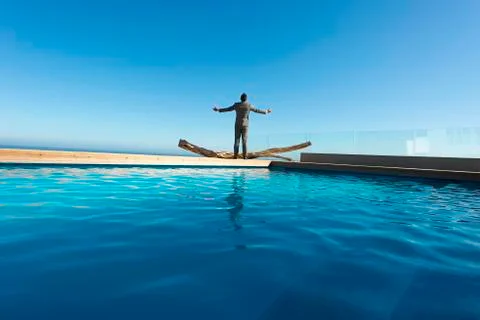 Executive breathing by the pool Stock Photos
