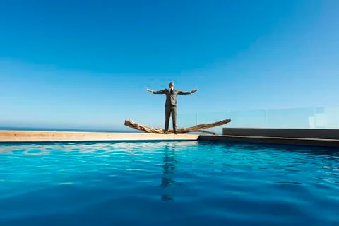 Executive breathing by the pool Stock Photos
