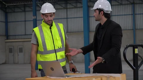 Executive business man handshake with warehouse manager in meeting  with blue Stock Footage 146820245