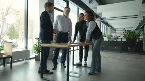 Executive business team standing at table, analyzing corporate strategy Video stock 311017685