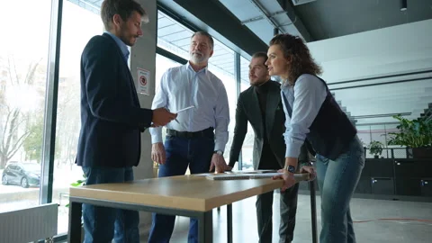 Executive business team standing at table, analyzing corporate strategy Video stock 311017704