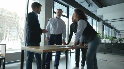 Executive business team standing at table, analyzing corporate strategy Video stock 311017751
