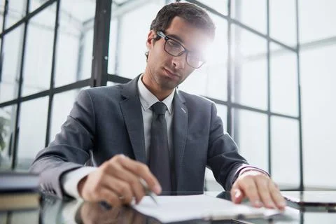 Executive ceo manager writing notes in notebook at workplace. Stock Photos