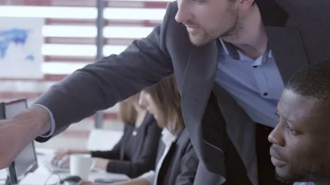 Executive checking employee's work at the office Stock Footage 74293592