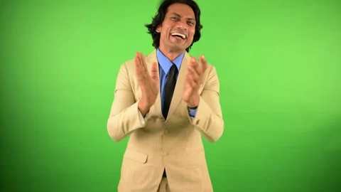 Executive chuckles loudly while applauding happily Stock Footage 307899433