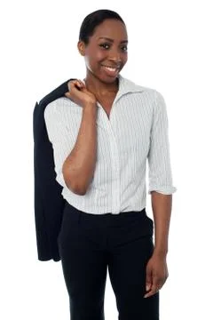 Executive with coat slung over her shoulder Stock Photos
