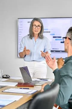 Executive corporate team discussing presentation in boardroom office. Foto stock